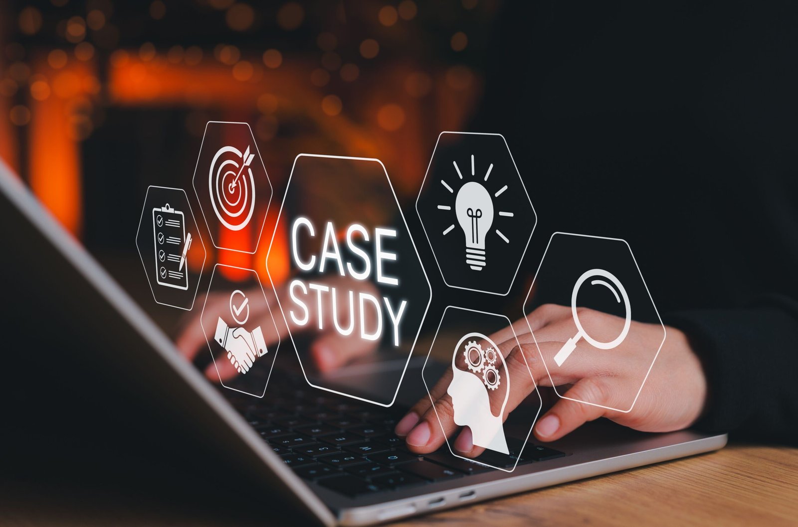 Dark background with orange bokeh; hex icons hover around a laptop, framing a CASE STUDY label with symbols like target, lightbulb, magnifier.